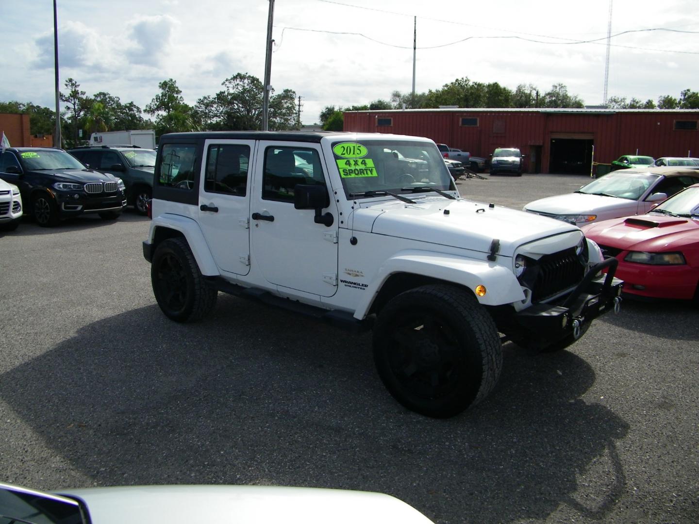 2015 White /Black Jeep Wrangler Unlimited Sahara 4WD (1C4BJWEGXFL) with an 3.6L V6 DOHC 24V FFV engine, Automatic transmission, located at 4000 Bee Ridge Road, Sarasota, FL, 34233, (941) 926-0300, 27.298664, -82.489151 - Photo#7